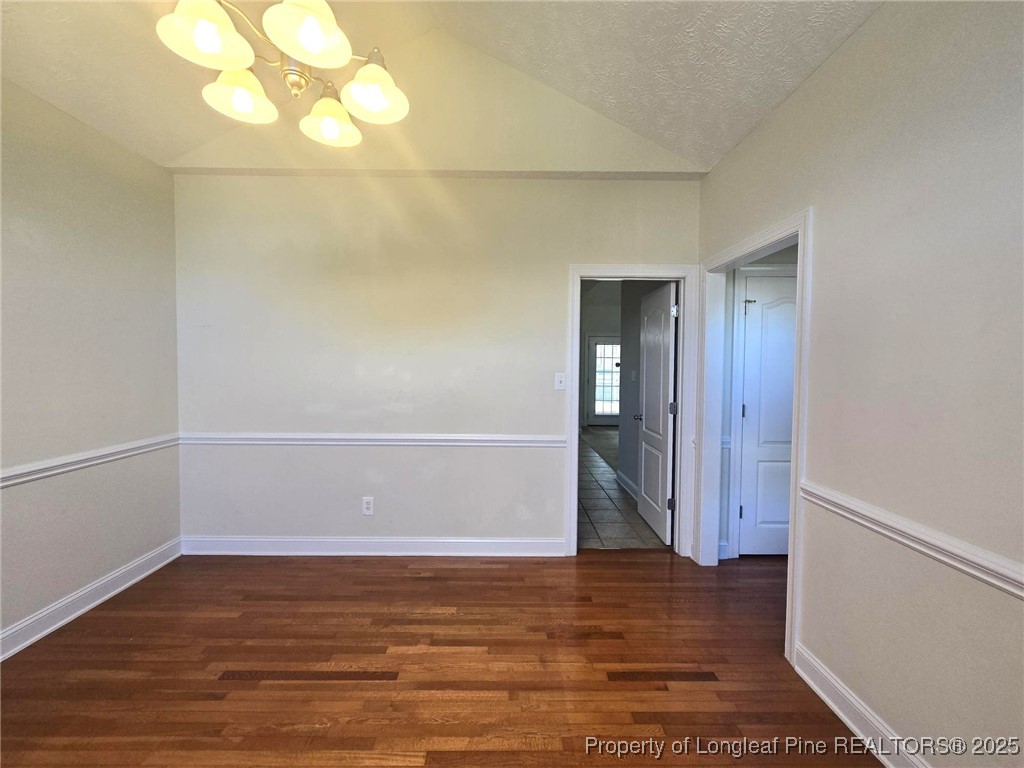 3941 Birkhoff Lane Fayetteville, NC 28304 - Photo 10 of 41 a view of an empty room with wooden floor and a window