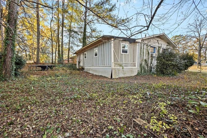 685 Bolton Road Northwest Atlanta, GA 30331 - Photo 21 of 21 a house that has a tree in front of it