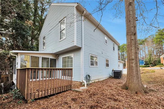 a view of backyard with a deck