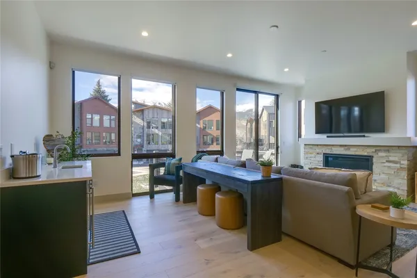 a living room with fireplace furniture and a flat screen tv