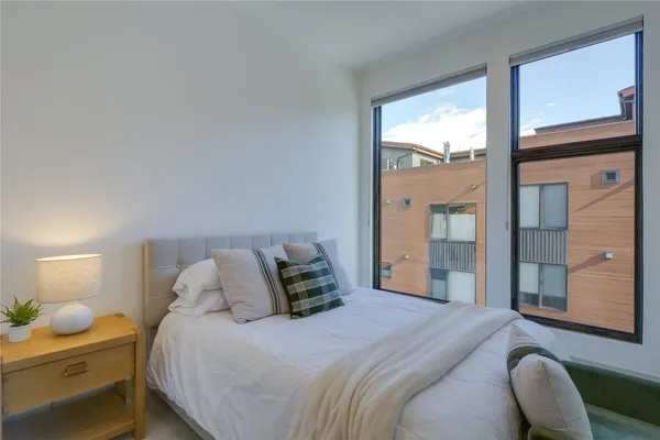 a bedroom with a bed and window