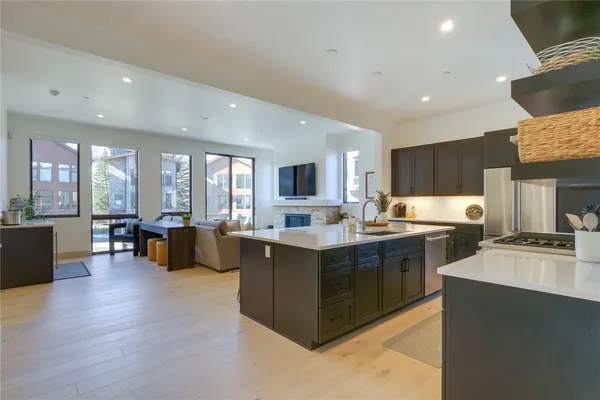 a large living room with stainless steel appliances granite countertop lots of counter top space