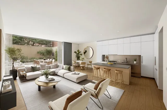 a view of a patio with couches and a table and chairs