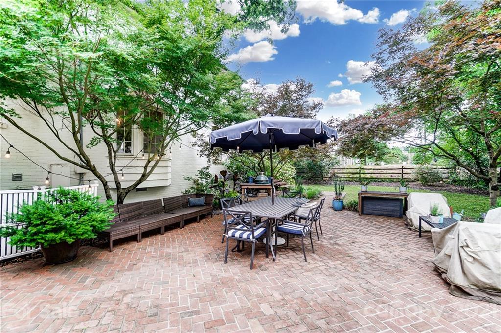 2610 Providence Road Charlotte, NC 28211 - Photo 28 of 37 a view of a patio with furniture and a yard