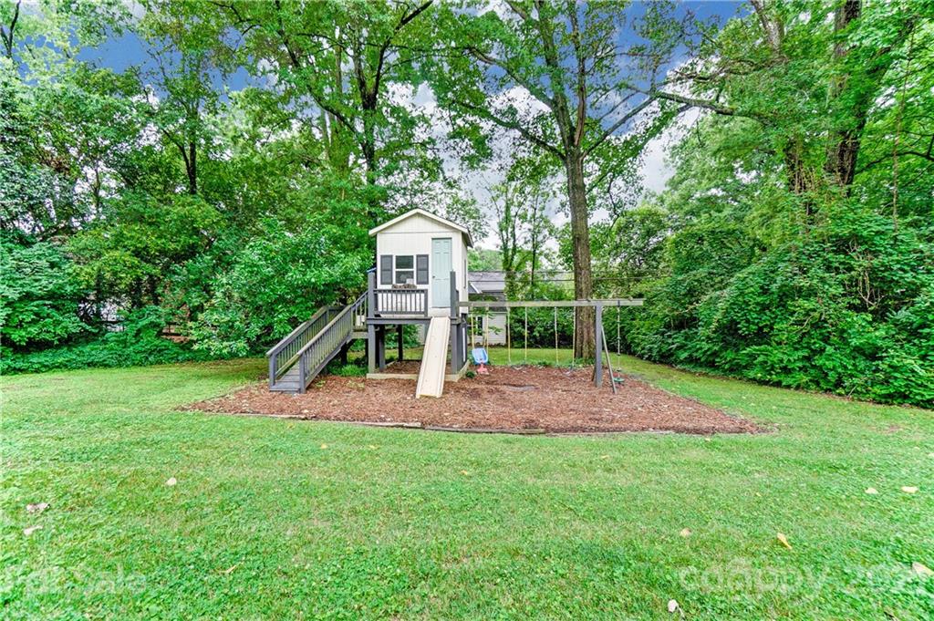 2610 Providence Road Charlotte, NC 28211 - Photo 32 of 37 a view of a house with a backyard