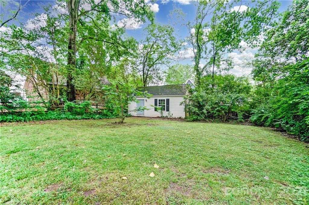 2610 Providence Road Charlotte, NC 28211 - Photo 33 of 37 a view of a house with a yard and a tree