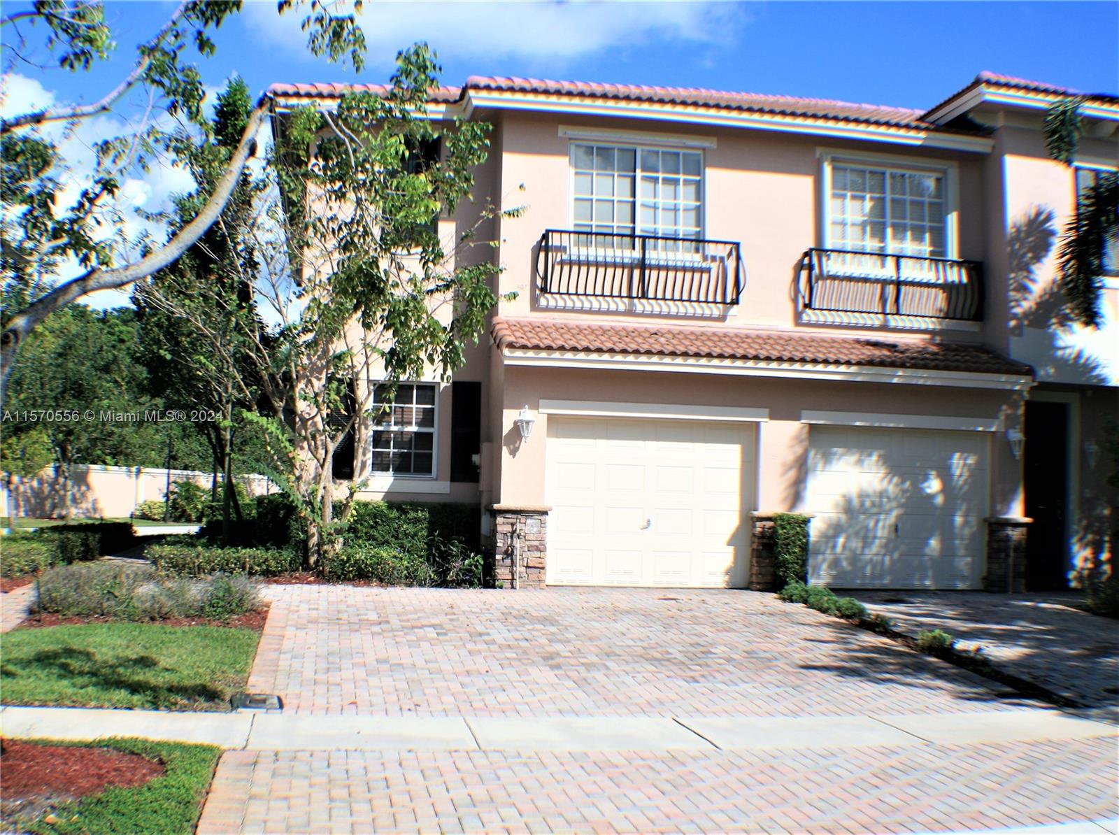 202 Las Brisas Circle Sunrise, FL 33326 - Photo 12 of 12 a front view of a house with garden