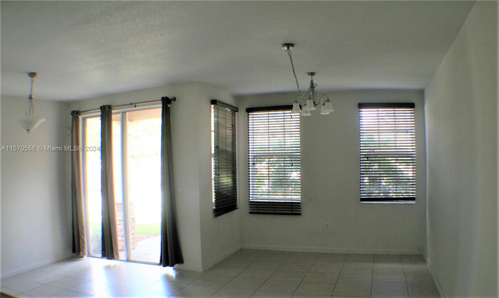 202 Las Brisas Circle Sunrise, FL 33326 - Photo 4 of 12 a view of an empty room with a window