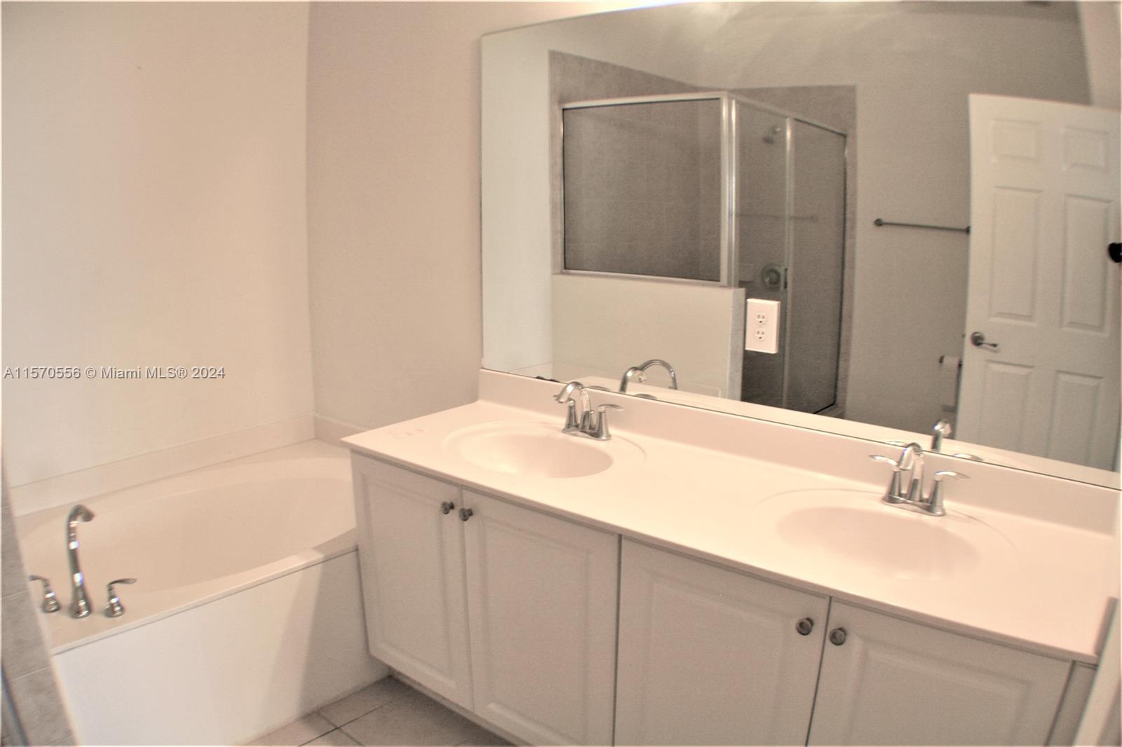 202 Las Brisas Circle Sunrise, FL 33326 - Photo 8 of 12 a bathroom with a sink and a bathtub