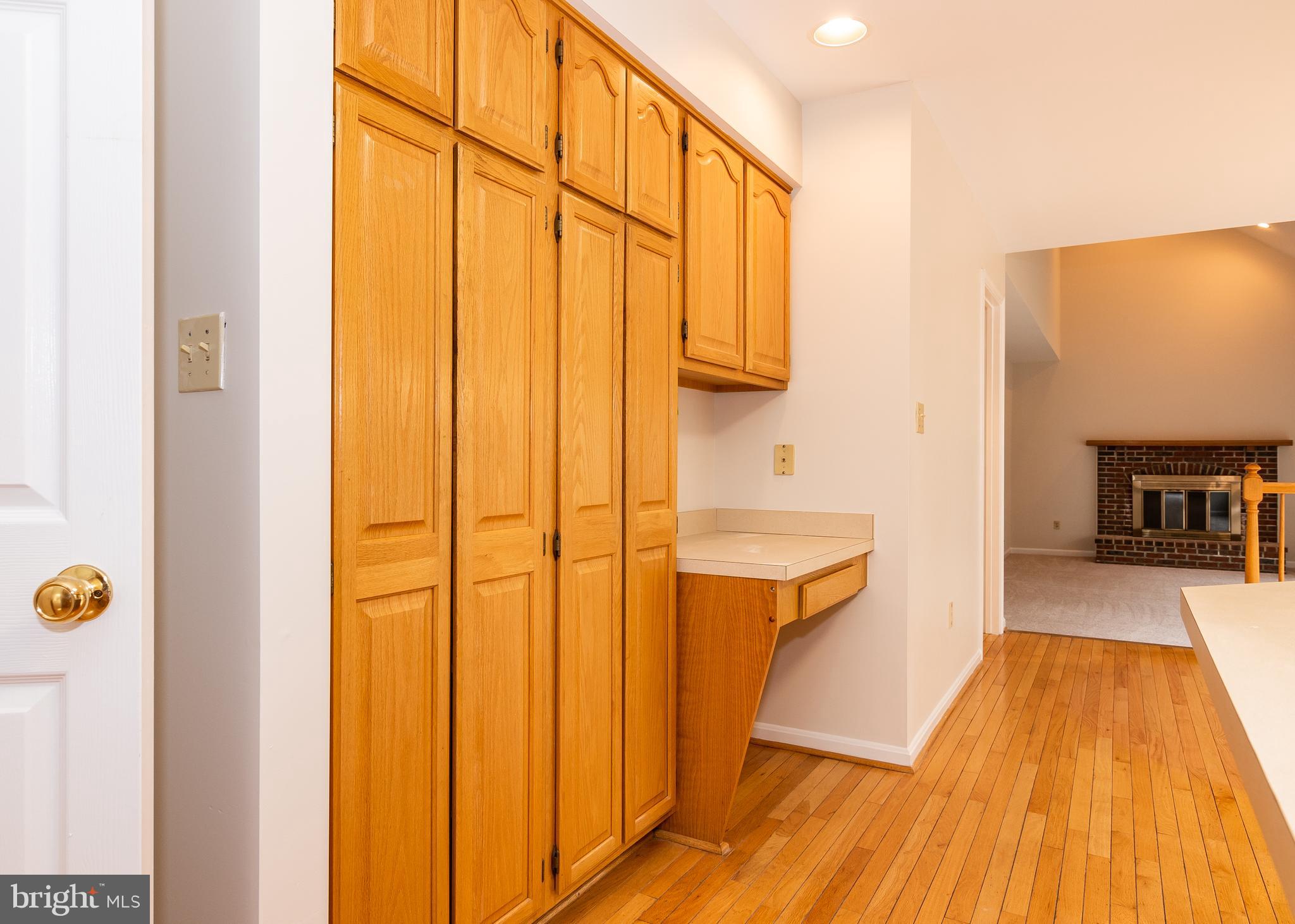 8207 Spring Branch Court Laurel, MD 20723 - Photo 17 of 40 wall of cabinets ns desk area