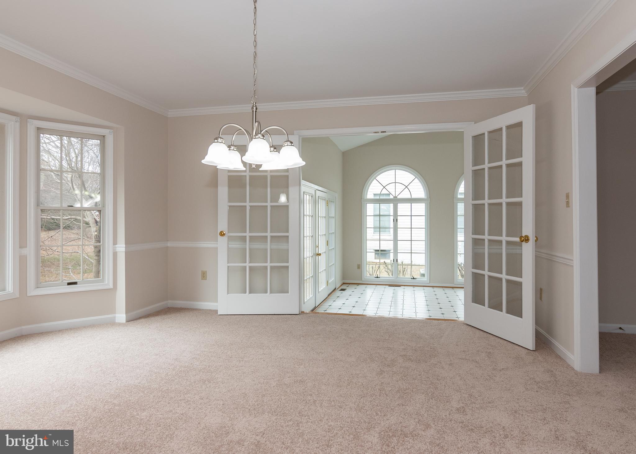 8207 Spring Branch Court Laurel, MD 20723 - Photo 10 of 40 Dining room with view into sun room