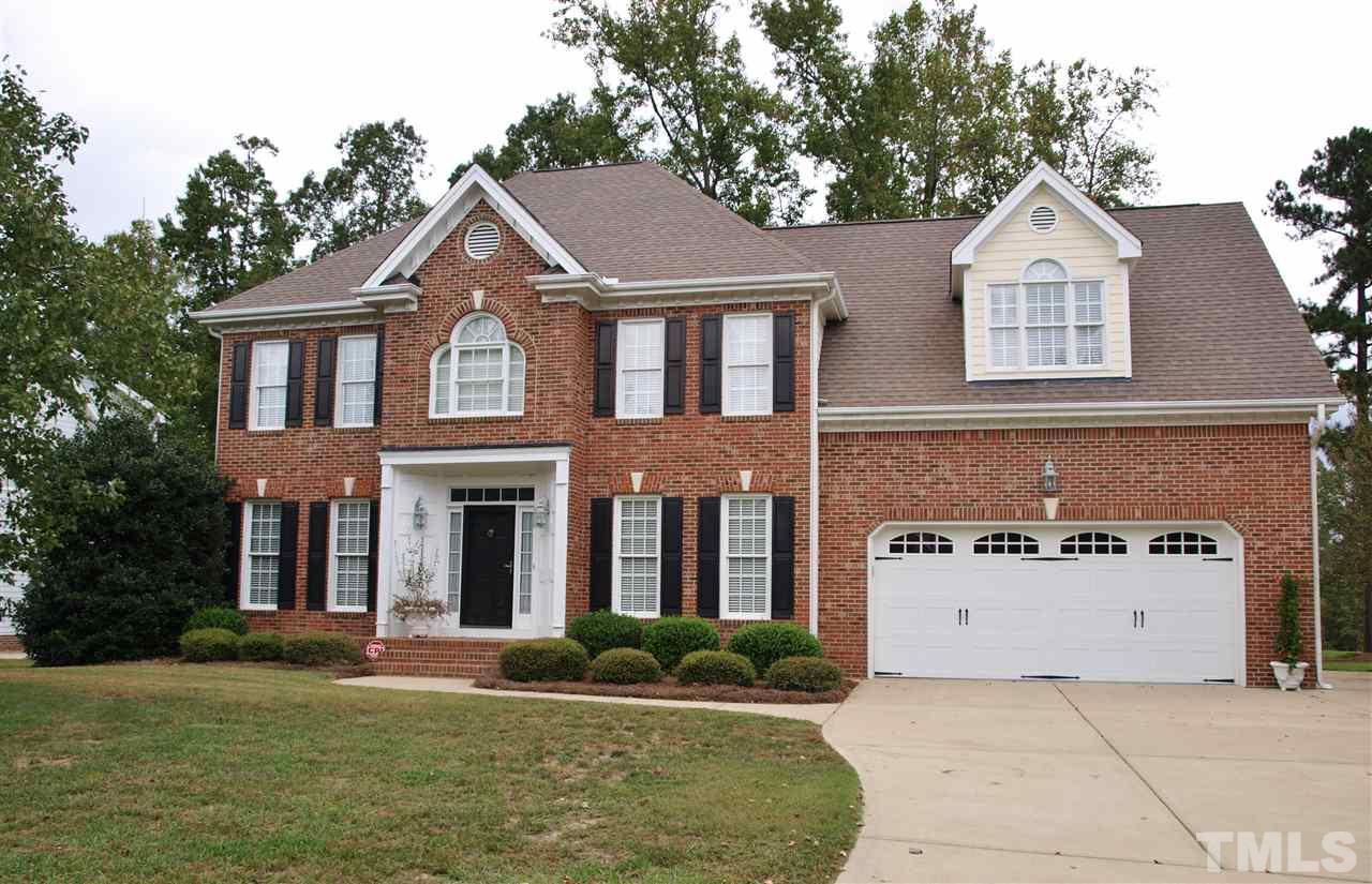 3317 La Costa Way Raleigh, NC 27610 - Photo 1 of 25 a front view of a house with a yard and garage