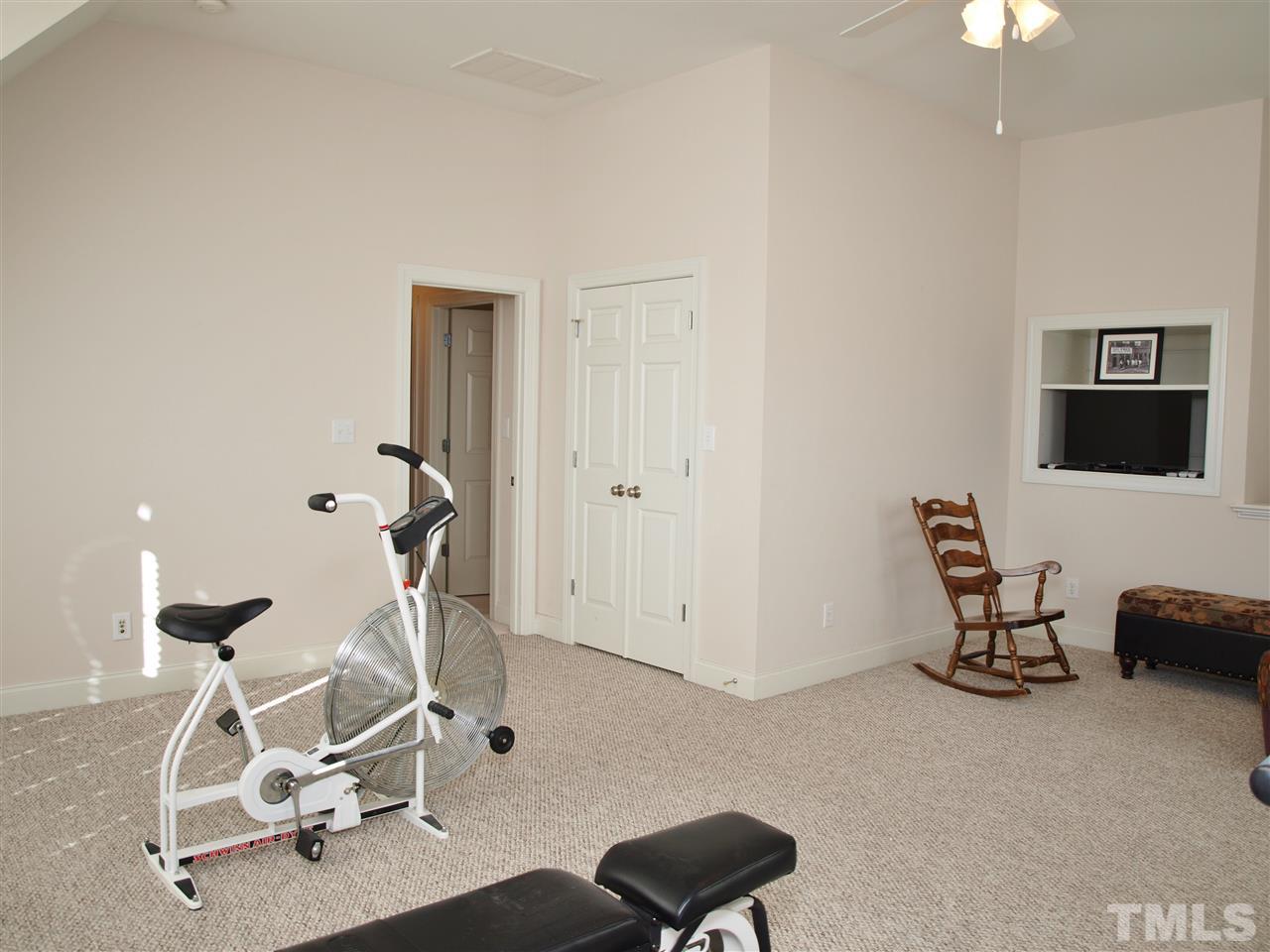 3317 La Costa Way Raleigh, NC 27610 - Photo 14 of 25 a view of a room with gym equipment