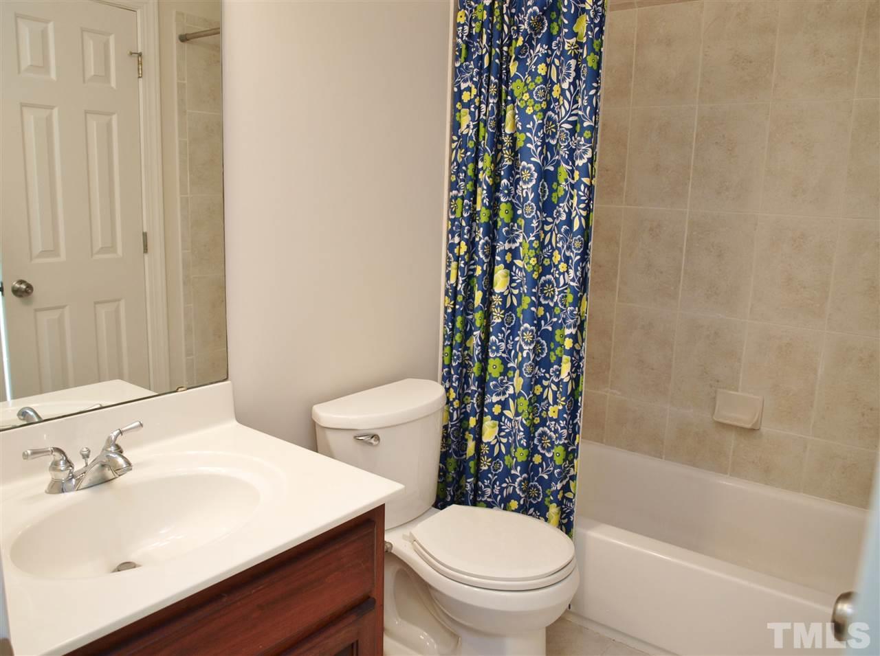 3317 La Costa Way Raleigh, NC 27610 - Photo 16 of 25 a bathroom with a sink toilet and shower