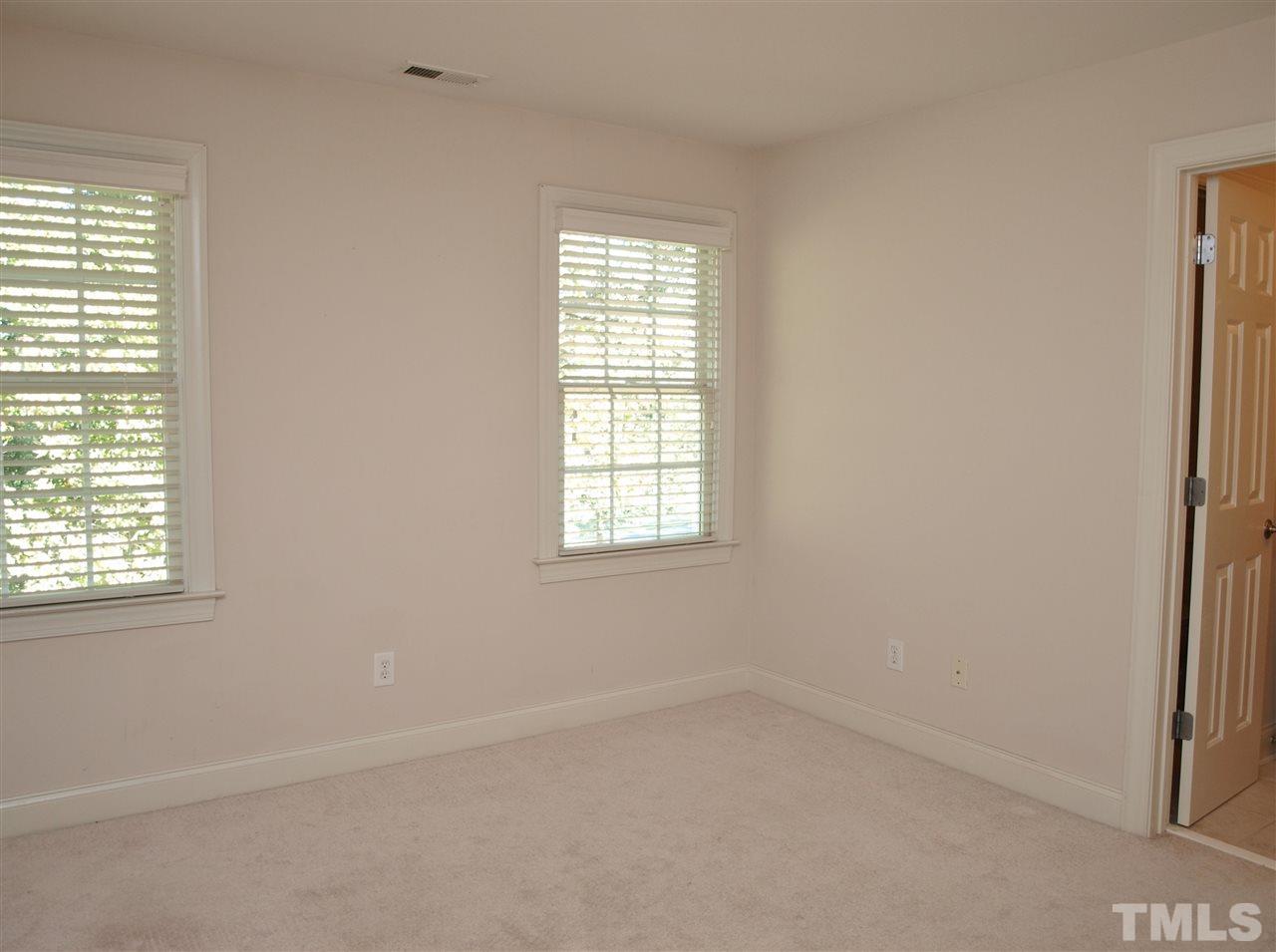 3317 La Costa Way Raleigh, NC 27610 - Photo 18 of 25 an empty room with a window