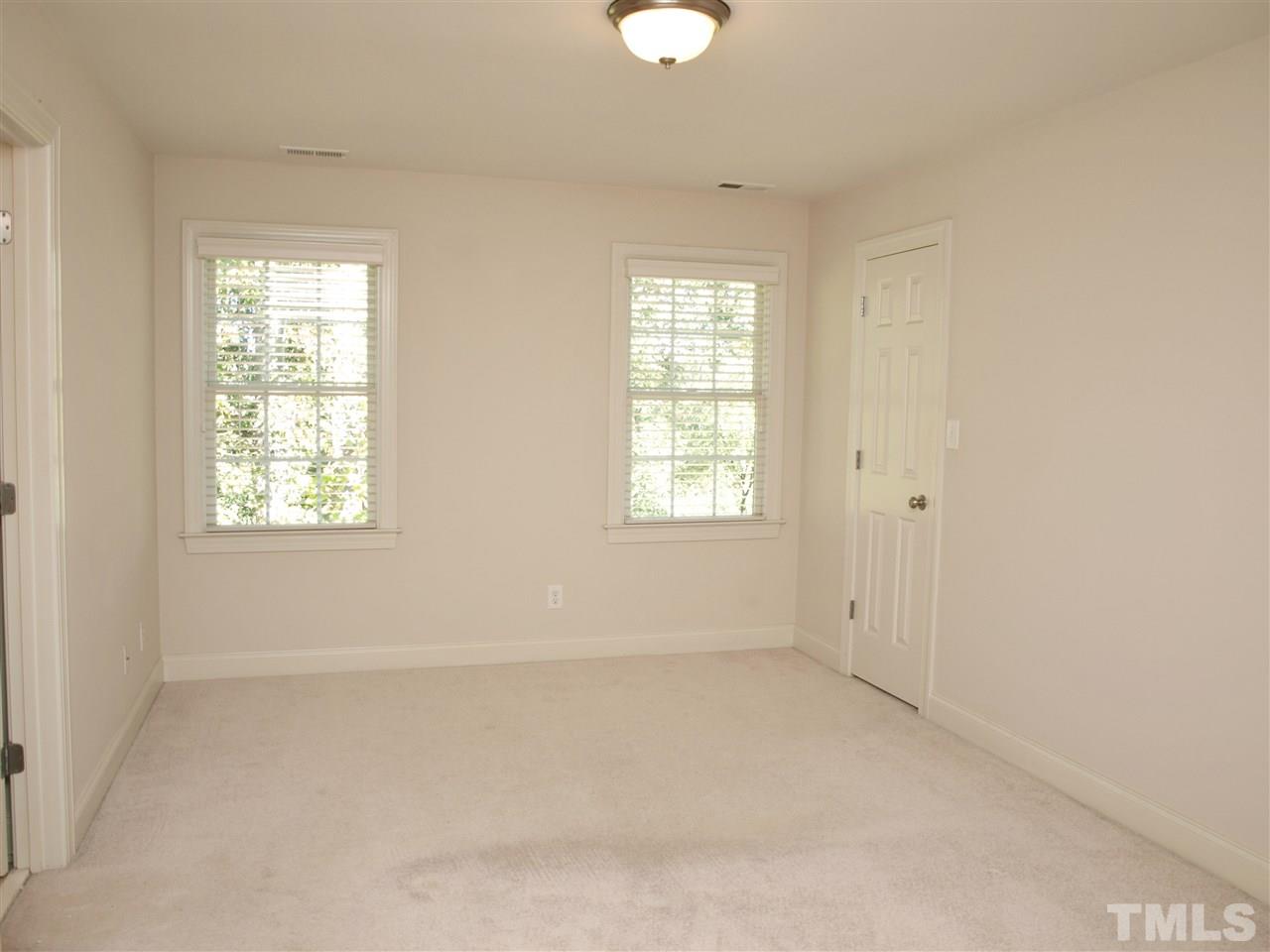 3317 La Costa Way Raleigh, NC 27610 - Photo 19 of 25 an empty room with windows