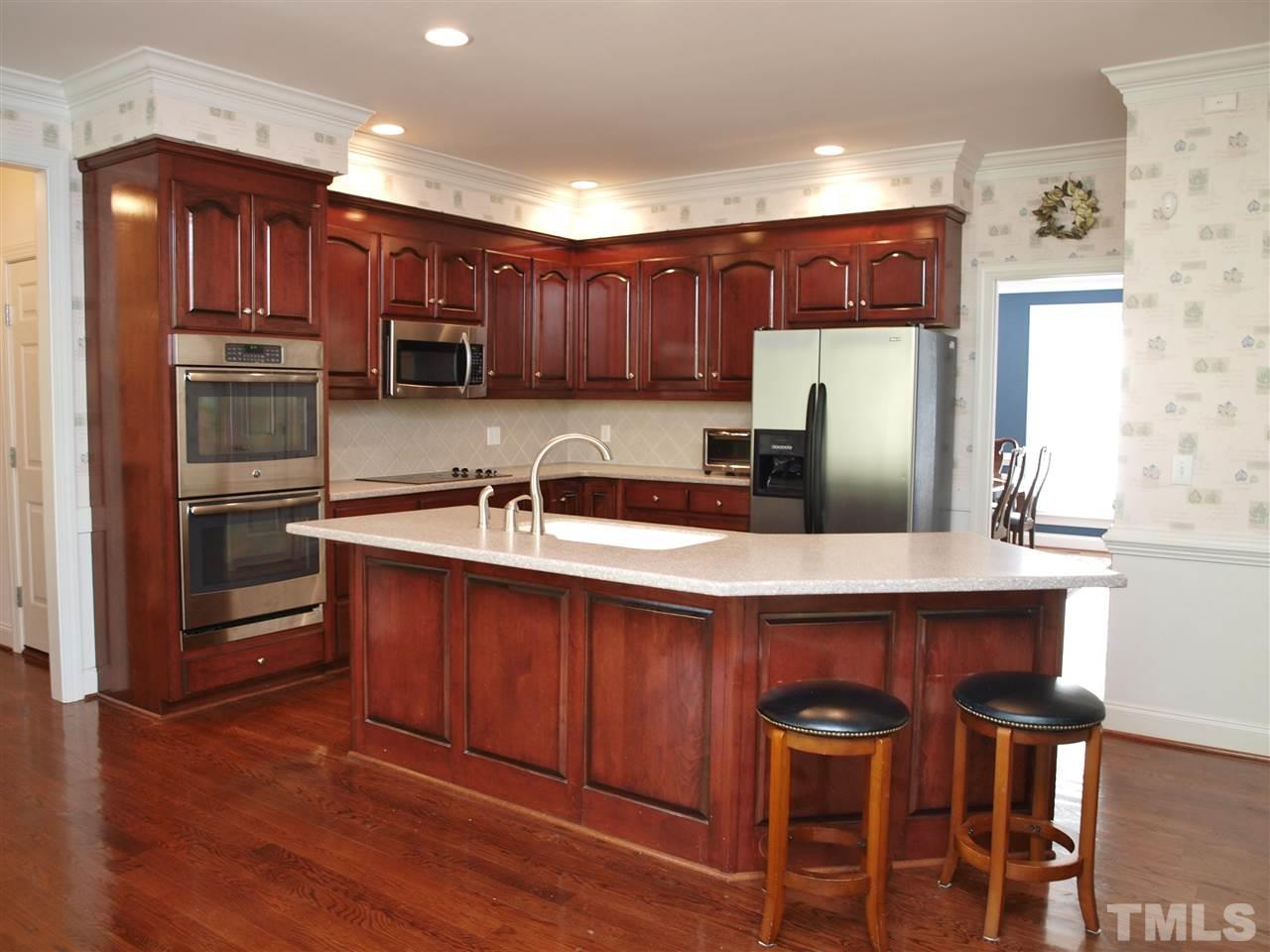 3317 La Costa Way Raleigh, NC 27610 - Photo 3 of 25 a kitchen with a sink cabinets and window