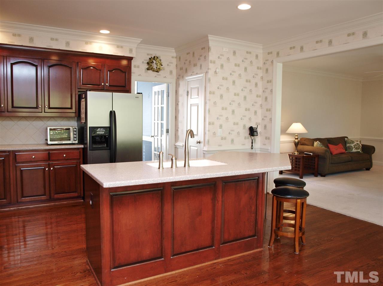 3317 La Costa Way Raleigh, NC 27610 - Photo 4 of 25 a kitchen with stainless steel appliances a sink and a refrigerator