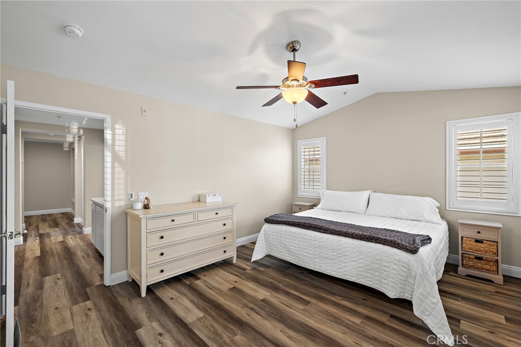 71 Sklar Street Ladera Ranch, CA 92694 - Photo 20 of 55 a bedroom with a bed and a chandelier