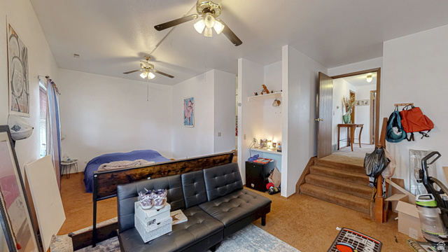 630 1100 West Provo, UT 84601 - Photo 56 of 64 Carpeted interior space featuring white walls and multiple ceiling fans