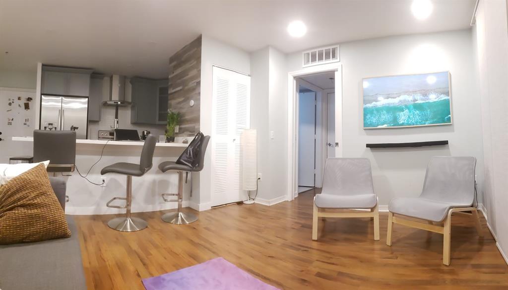 410 South Park Road, Unit 210 Hollywood, FL 33021 - Photo 2 of 5 a living room with furniture and a wooden floor