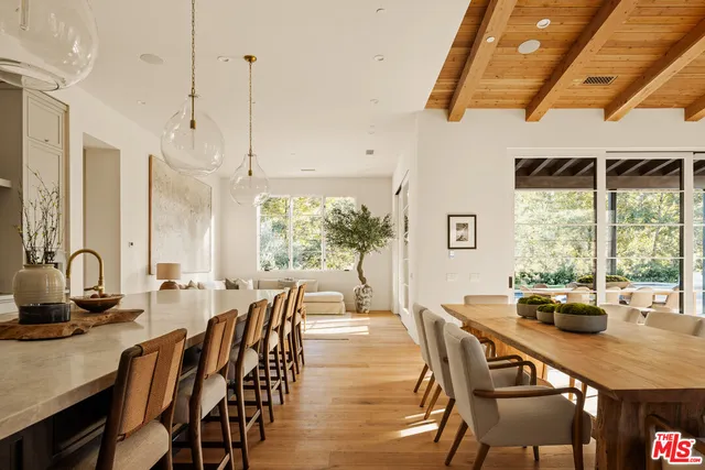 a dining room with furniture window and outside view