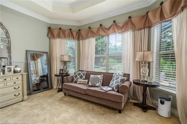 a bathroom with a double vanity sink a large mirror and a bathtub