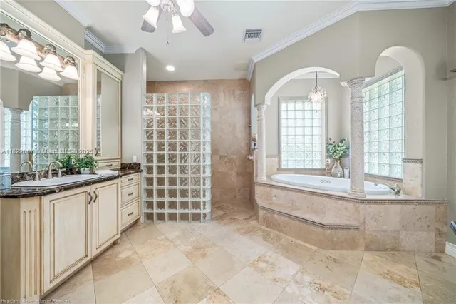a bath tub sitting in a bathroom next to a window