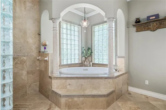 a living room with furniture a flat screen tv and a window