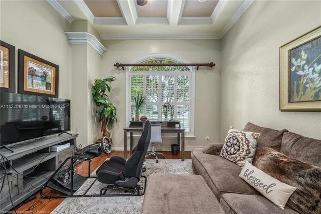 a livingroom with workspace and a couch
