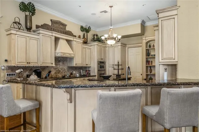 a living room with furniture a flat screen tv and a large window