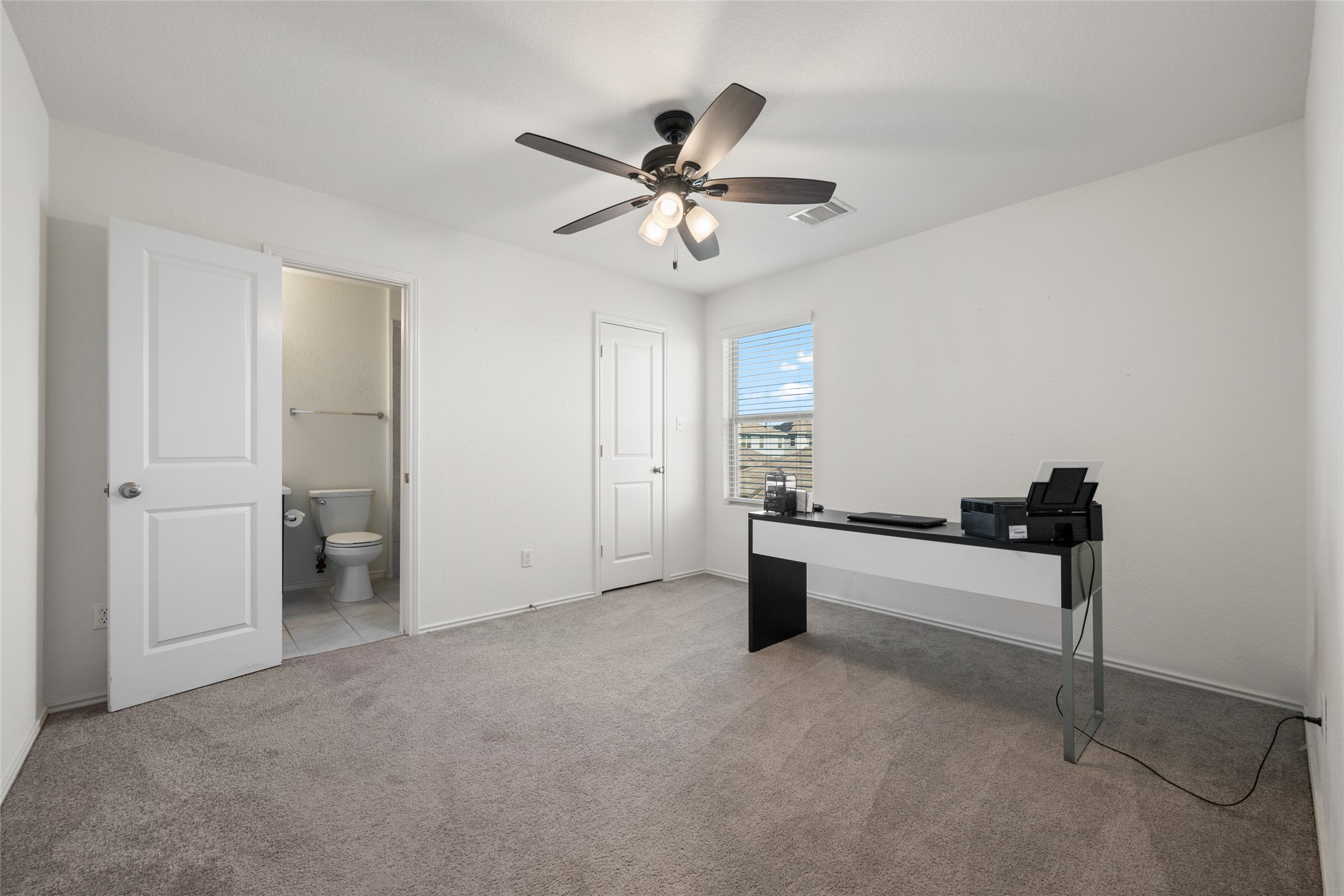 524 Circle Way, Unit 12F Jarrell, TX 76537 - Photo 29 of 34 Unfurnished office featuring light colored carpet and ceiling fan