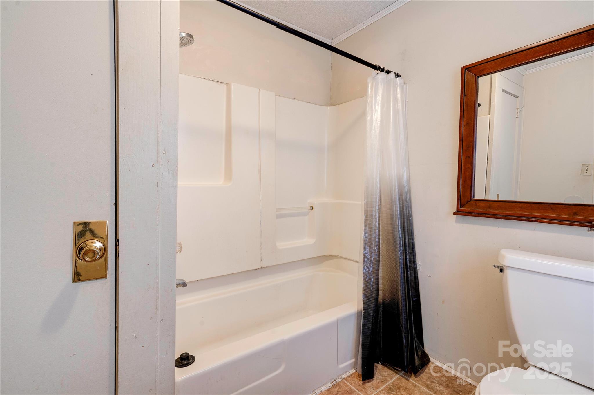 1521 Kings Road Shelby, NC 28150 - Photo 29 of 38 a bathroom with a bathtub and a shower