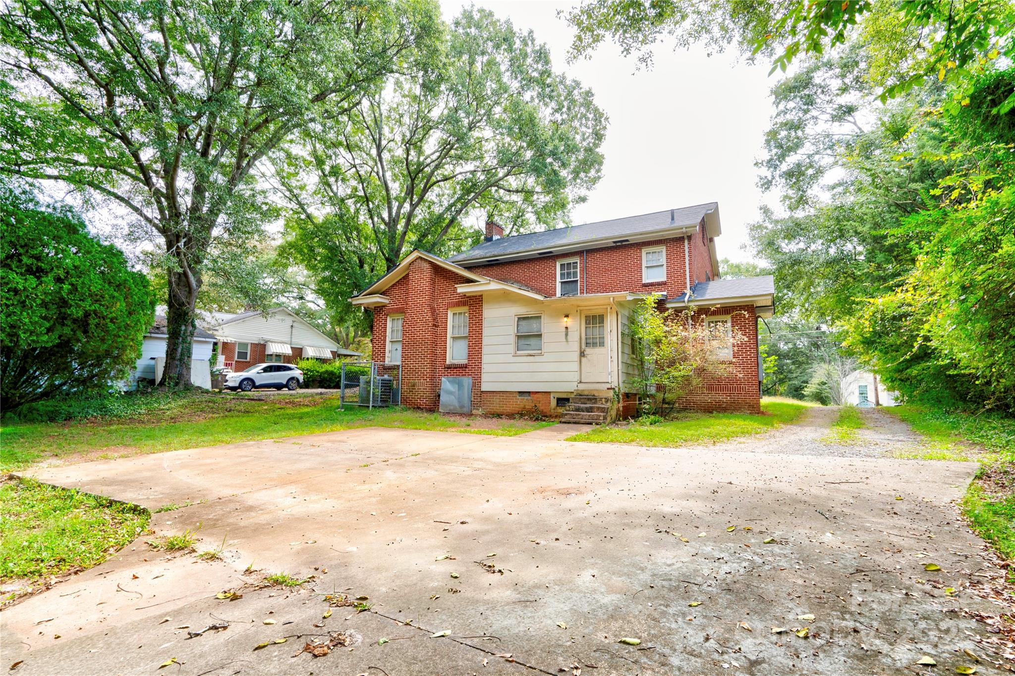 1521 Kings Road Shelby, NC 28150 - Photo 36 of 38 a front view of a house with a yard and trees