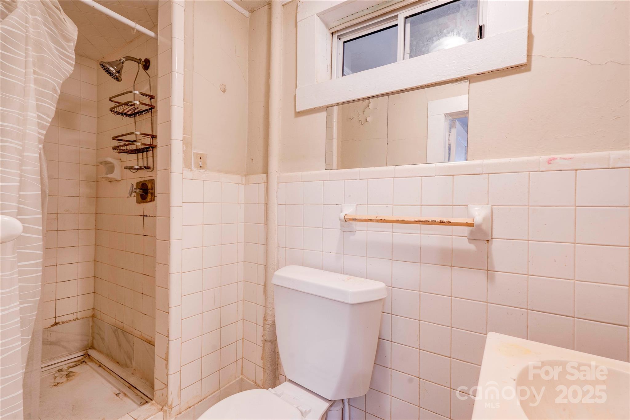 1521 Kings Road Shelby, NC 28150 - Photo 7 of 38 a bathroom with a toilet and a shower