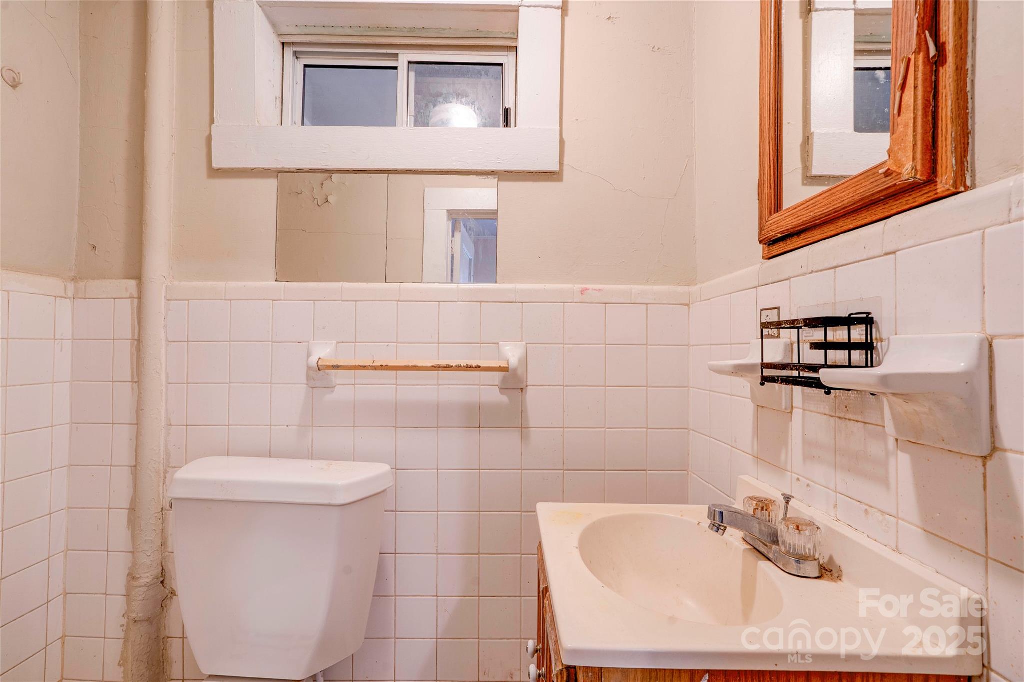 1521 Kings Road Shelby, NC 28150 - Photo 8 of 38 a bathroom with a sink a toilet and mirror