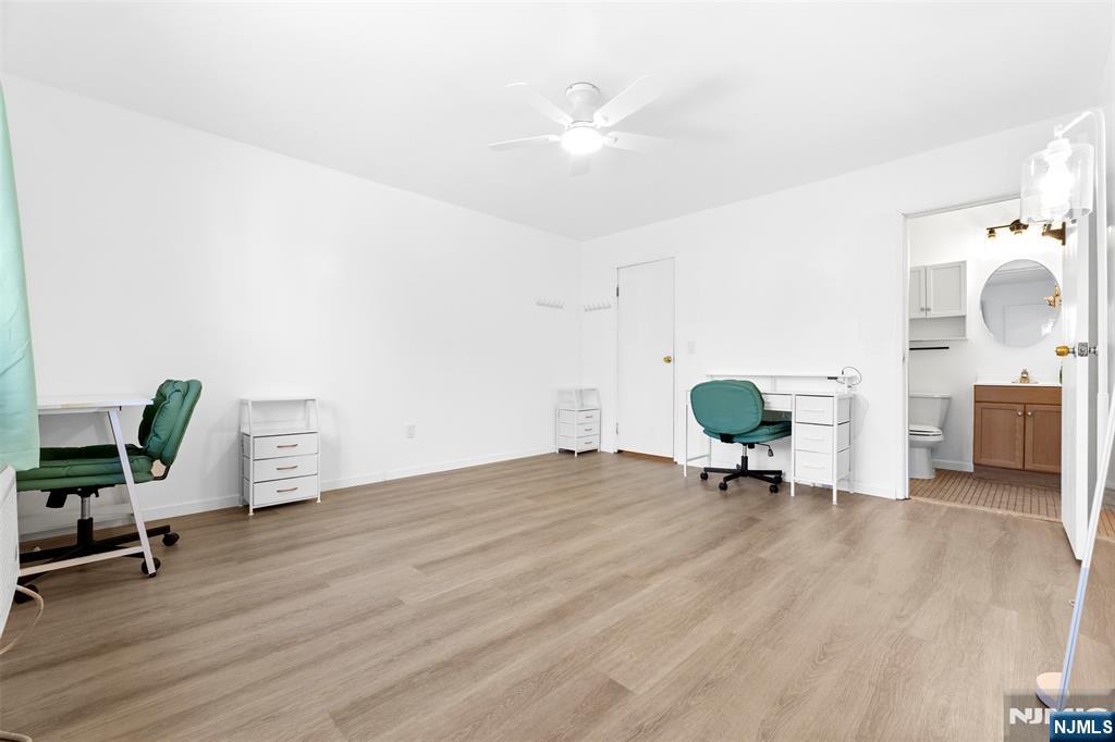 9 Vreeland Avenue, Unit 3A Hackensack, NJ 07601 - Photo 7 of 24 a view of a livingroom with chairs and workspace