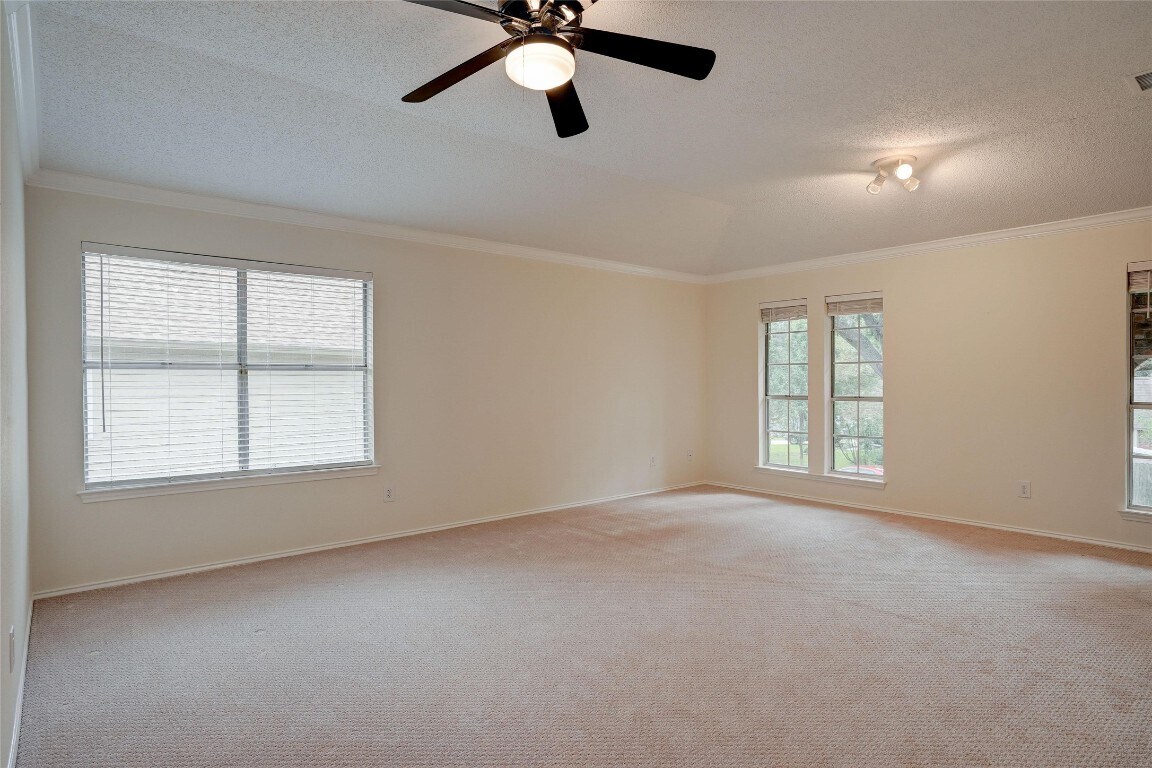 7604 Napier Trail Austin, TX 78729 - Photo 14 of 27 a view of an empty room with a window