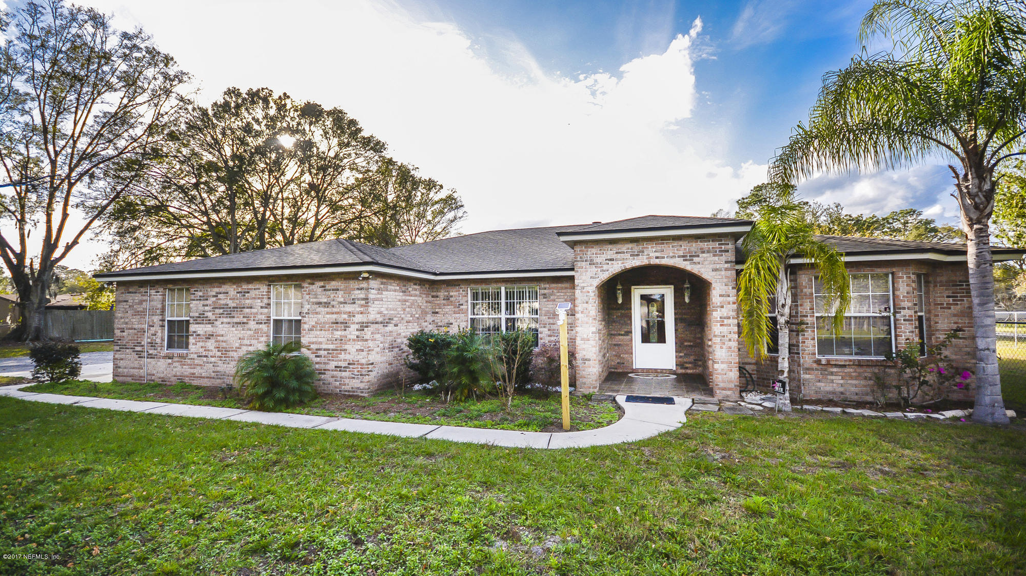 4822 Ricker Road Jacksonville, FL 32210 - Photo 1 of 50 a front view of a house with garden