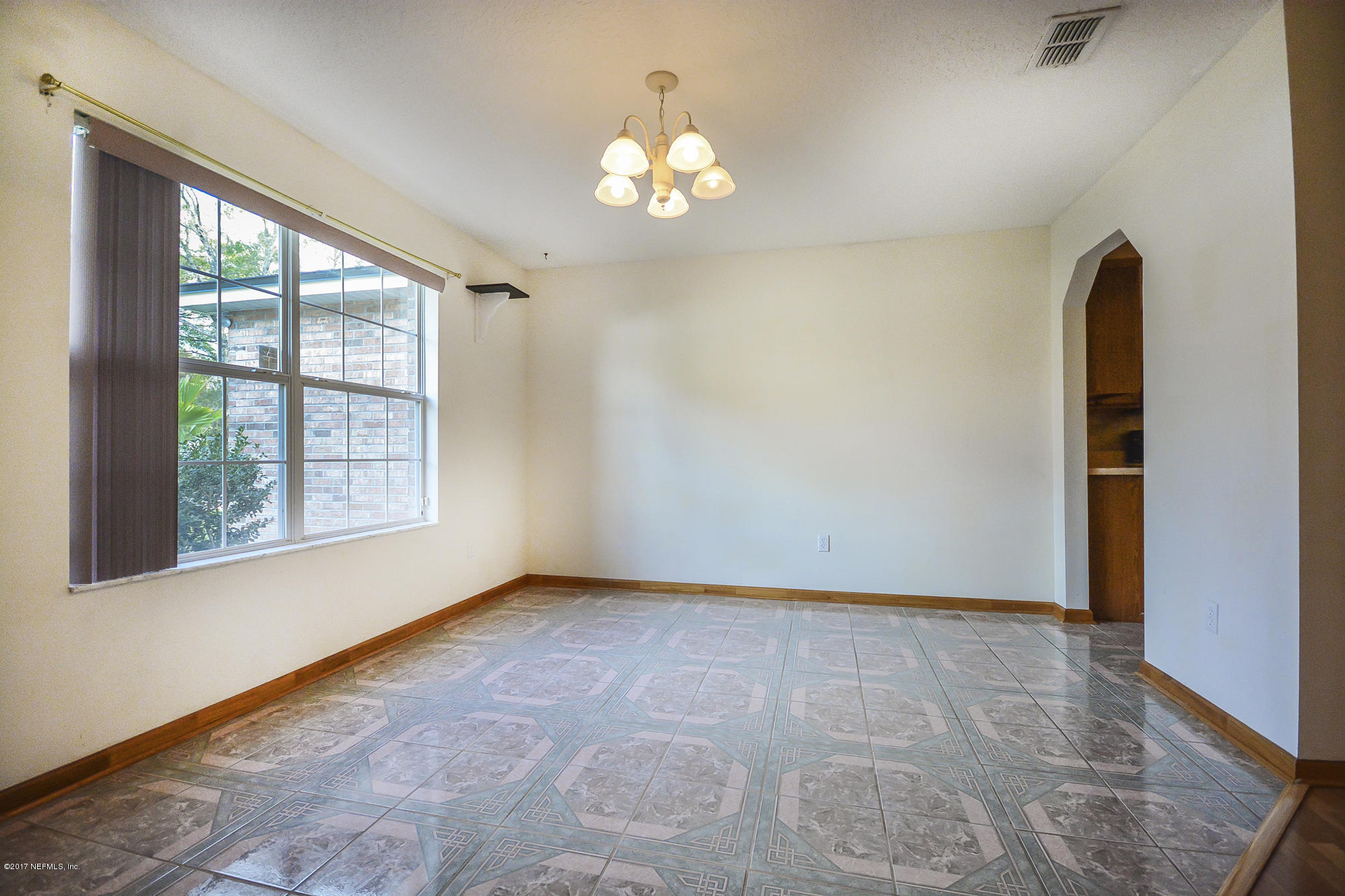 4822 Ricker Road Jacksonville, FL 32210 - Photo 15 of 50 a view of an empty room with a window