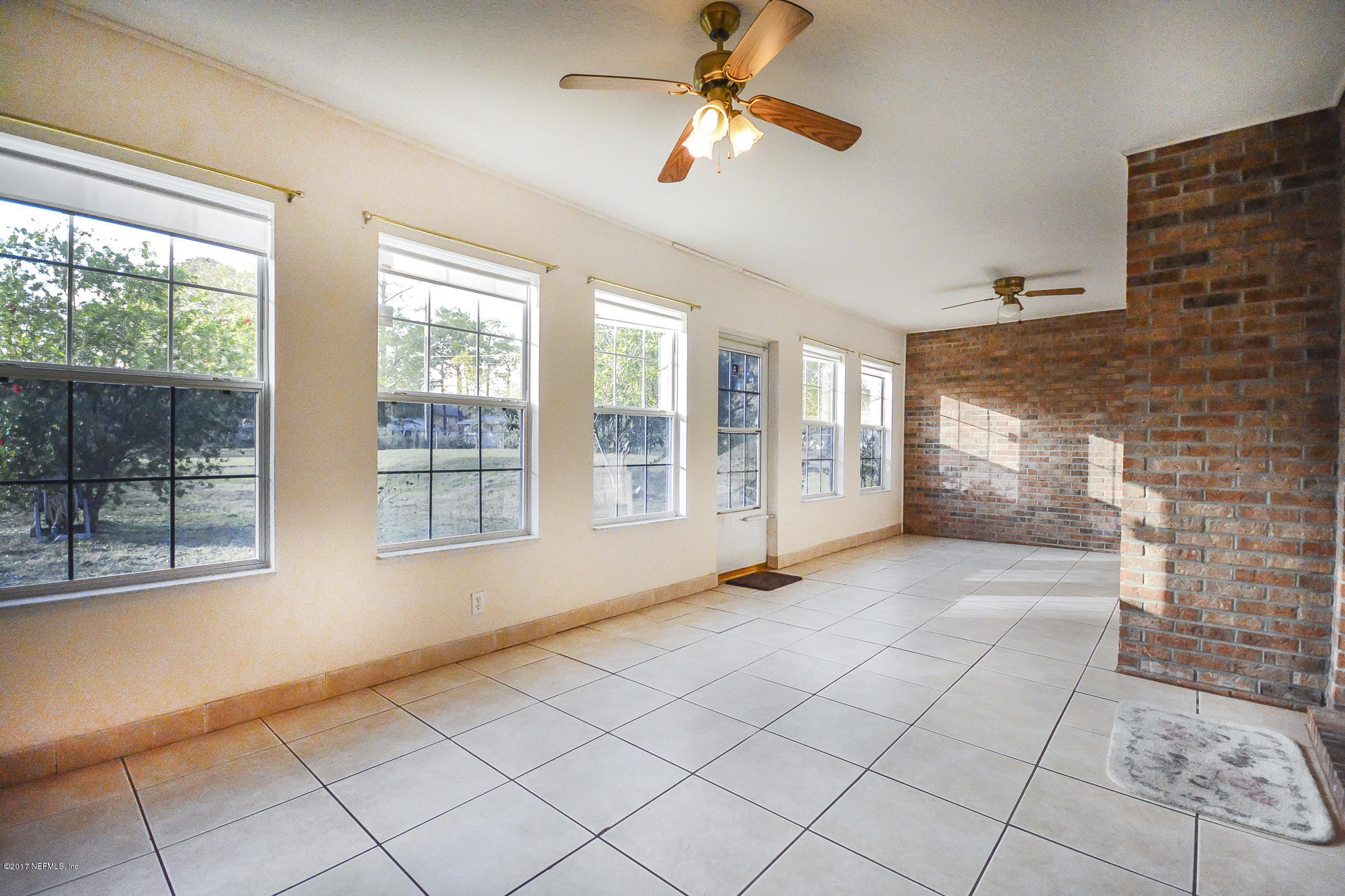 4822 Ricker Road Jacksonville, FL 32210 - Photo 21 of 50 a view of an empty room with a window