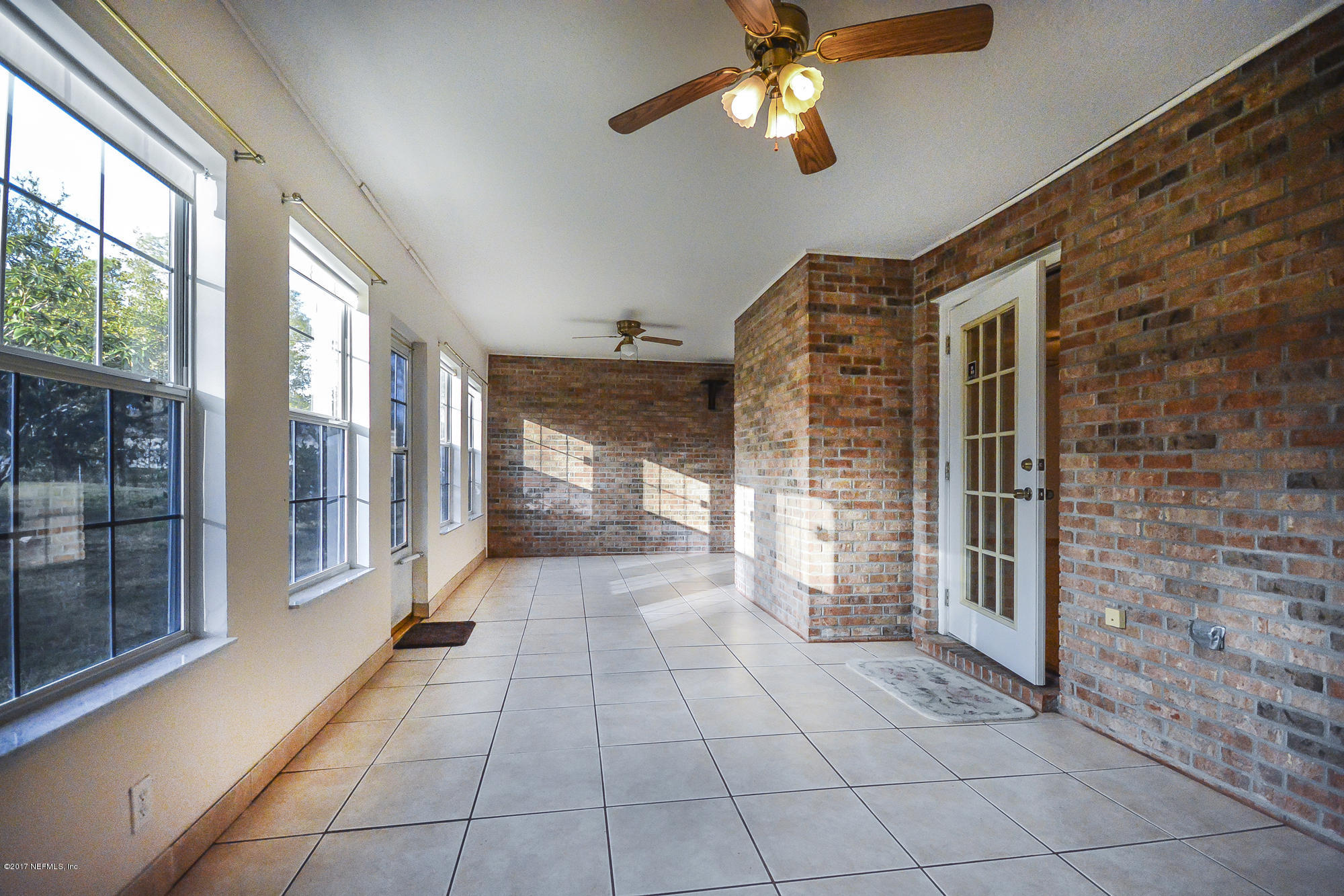 4822 Ricker Road Jacksonville, FL 32210 - Photo 22 of 50 a view of a hallway with windows