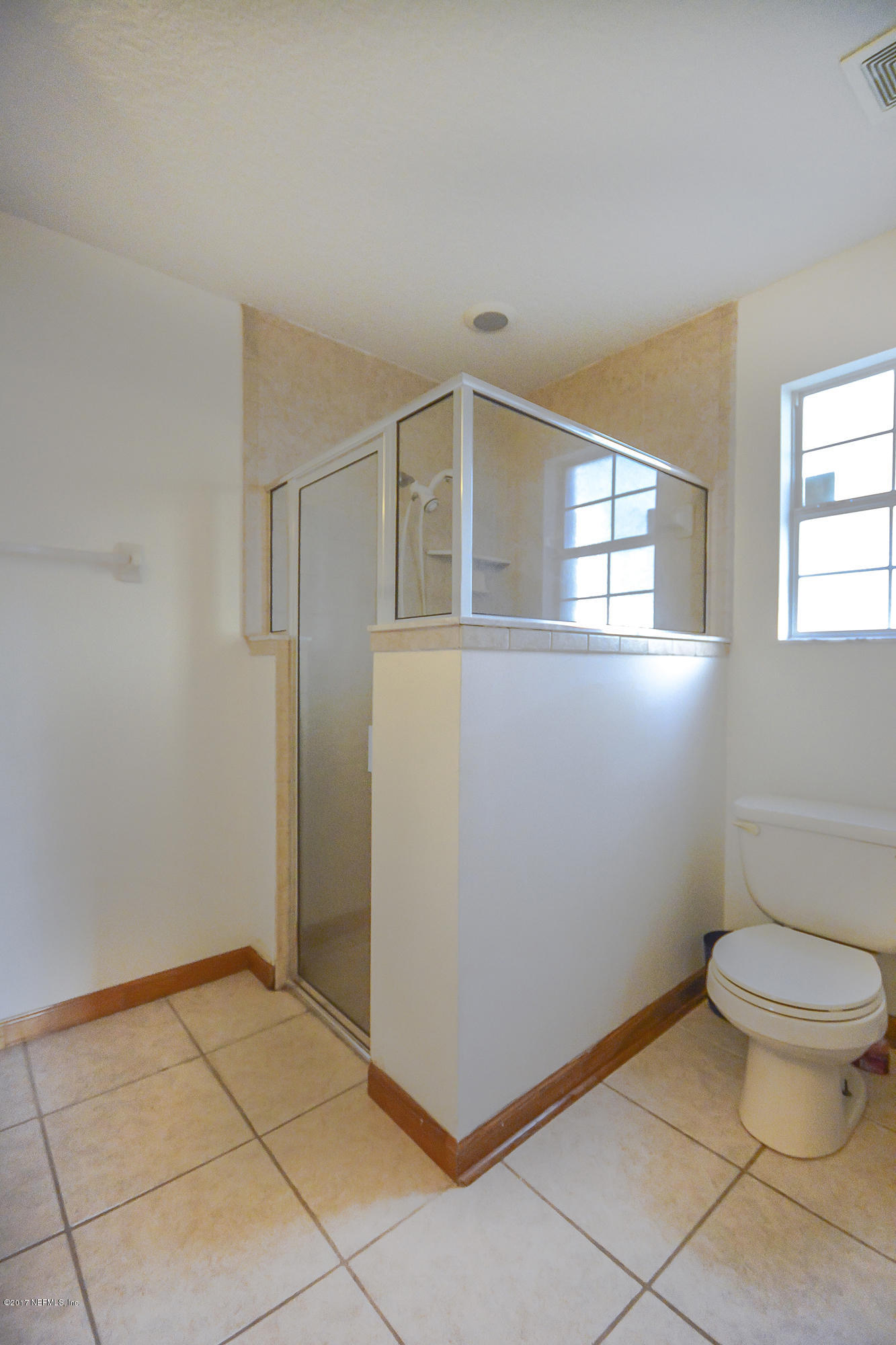 4822 Ricker Road Jacksonville, FL 32210 - Photo 26 of 50 a bathroom with a toilet