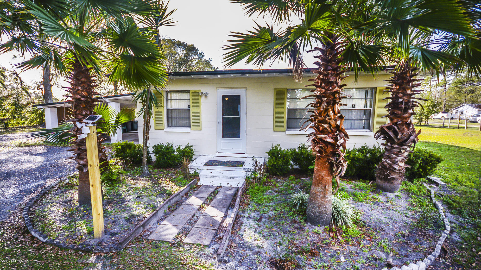4822 Ricker Road Jacksonville, FL 32210 - Photo 3 of 50 a front view of a house with garden