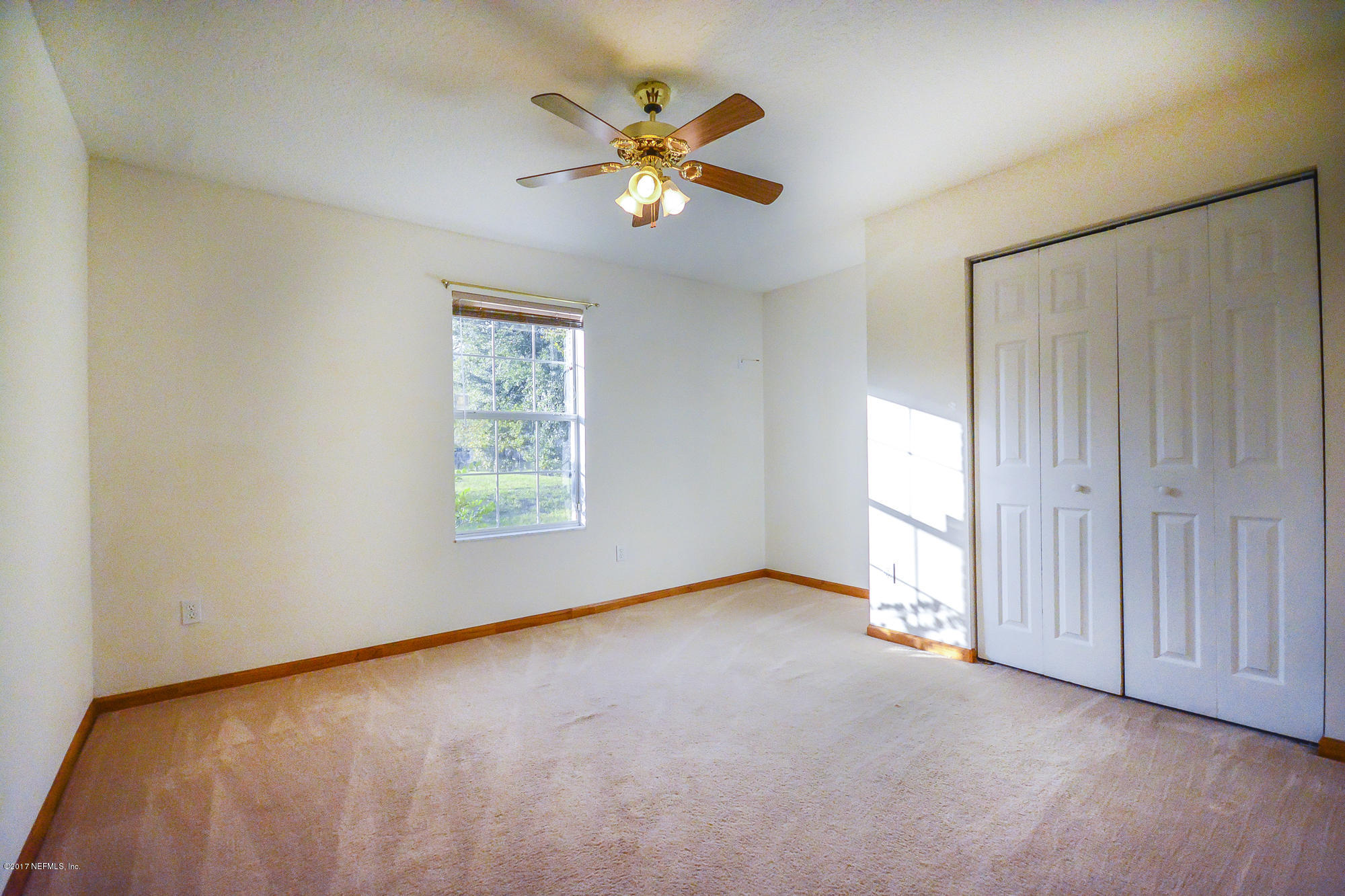 4822 Ricker Road Jacksonville, FL 32210 - Photo 31 of 50 a view of an empty room with a window