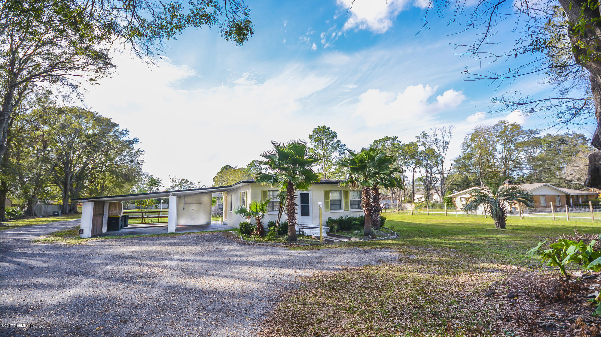 4822 Ricker Road Jacksonville, FL 32210 - Photo 35 of 50 a front view of a house with garden