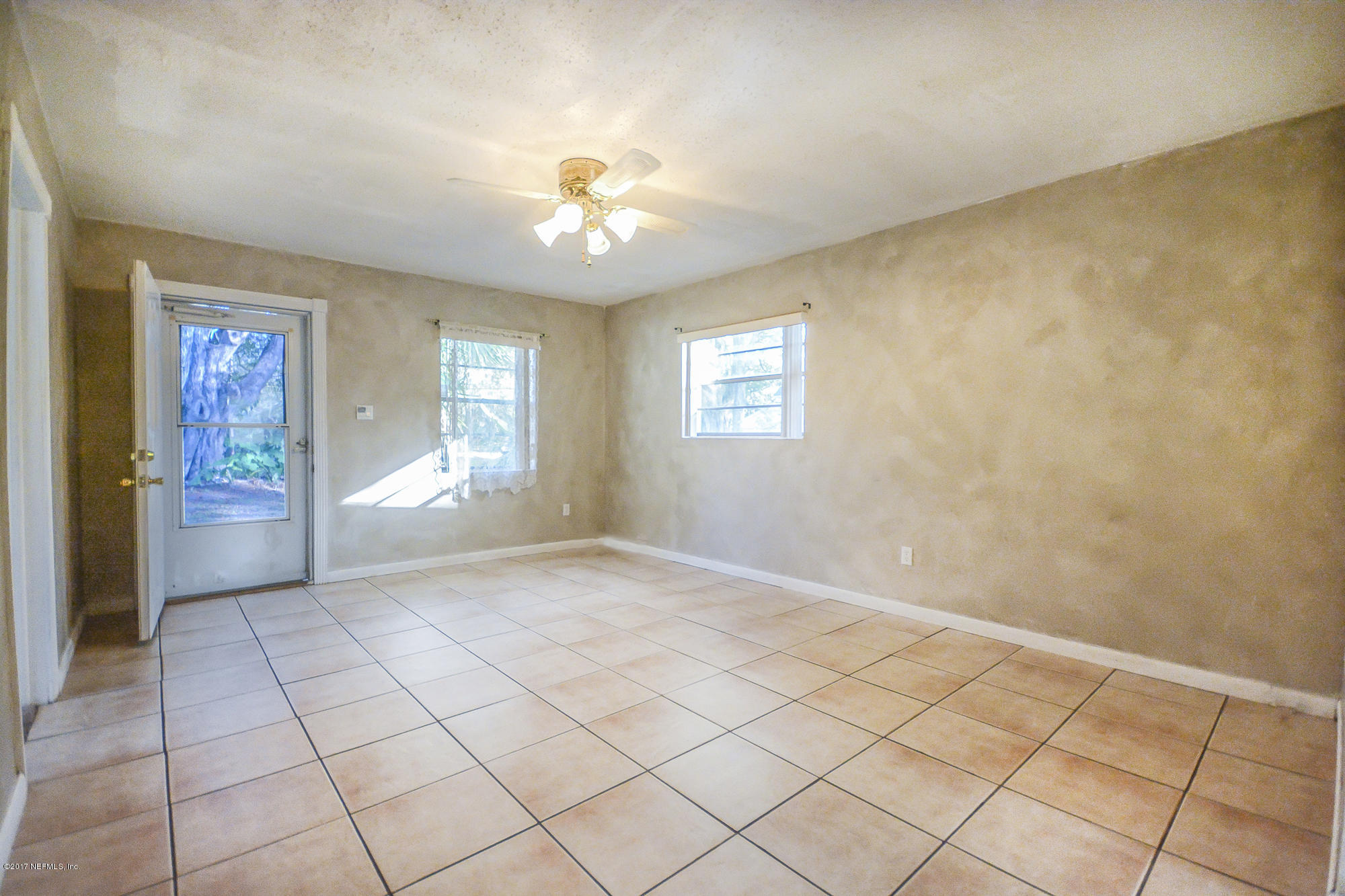 4822 Ricker Road Jacksonville, FL 32210 - Photo 36 of 50 a view of an empty room with a window