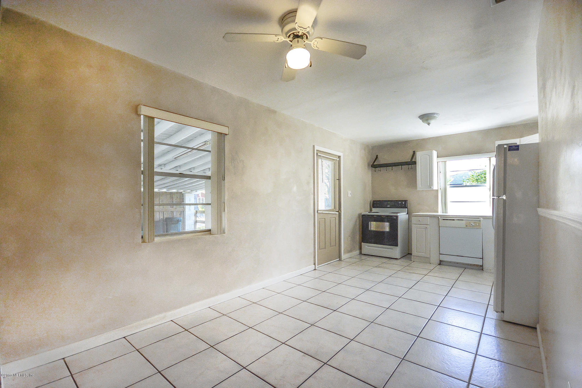 4822 Ricker Road Jacksonville, FL 32210 - Photo 38 of 50 a view of a kitchen with furniture and windows