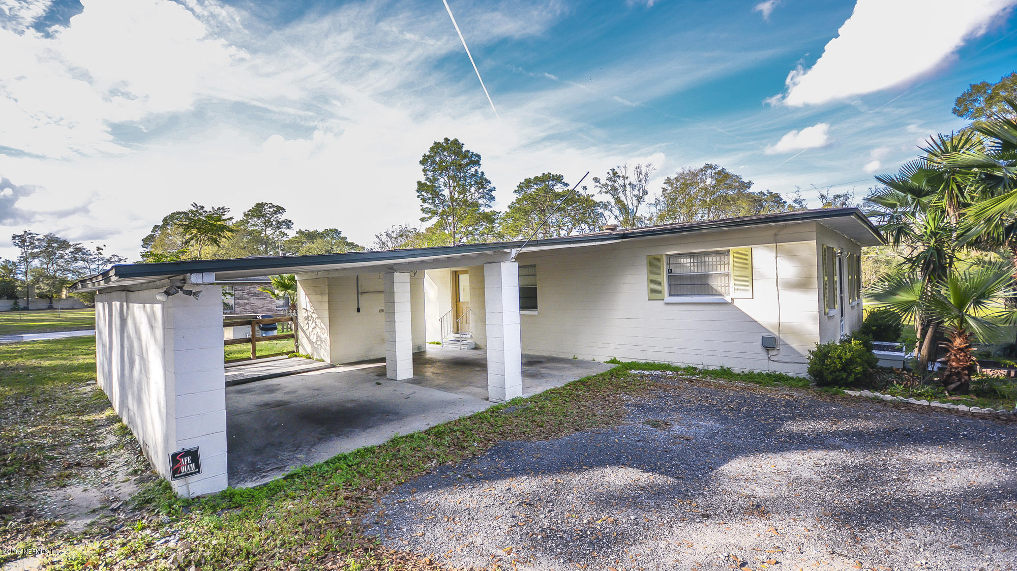 4822 Ricker Road Jacksonville, FL 32210 - Photo 4 of 50 a front view of a house with garden