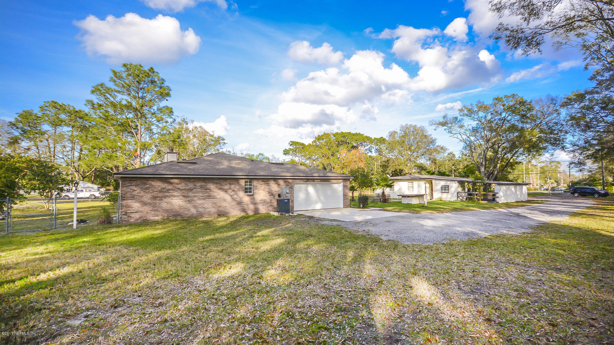 4822 Ricker Road Jacksonville, FL 32210 - Photo 49 of 50 a view of yard with swimming pool and green space